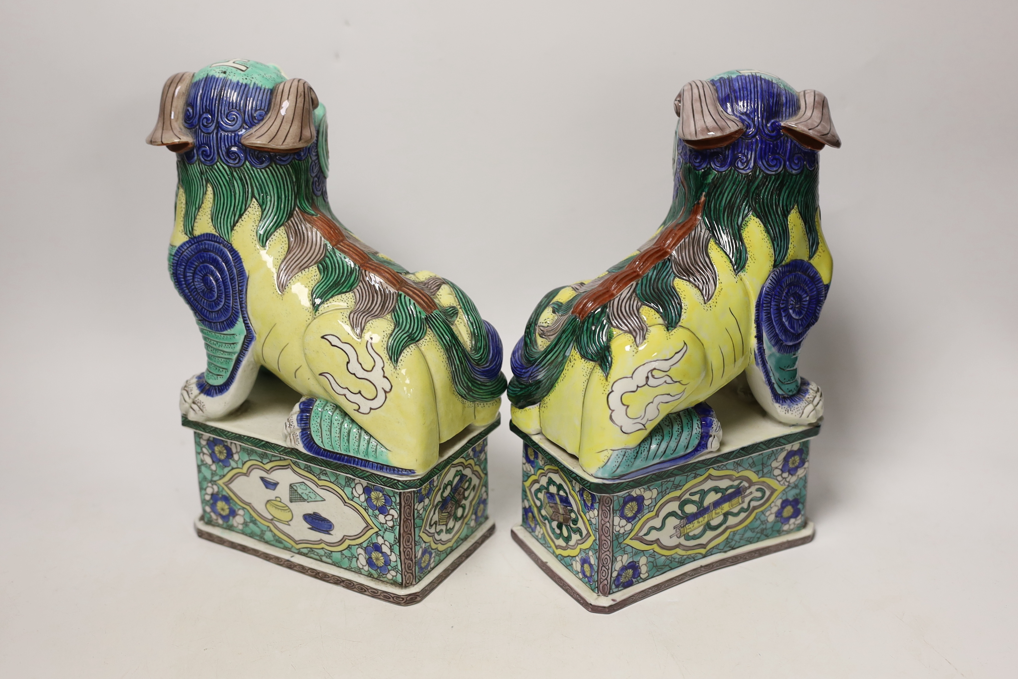 A pair of large 20th century Chinese or Samson enamelled porcelain figures of Buddhist Lions, 24cm